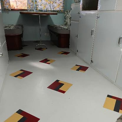 New white vinyl caravan floor with a red, yellow and black block motif