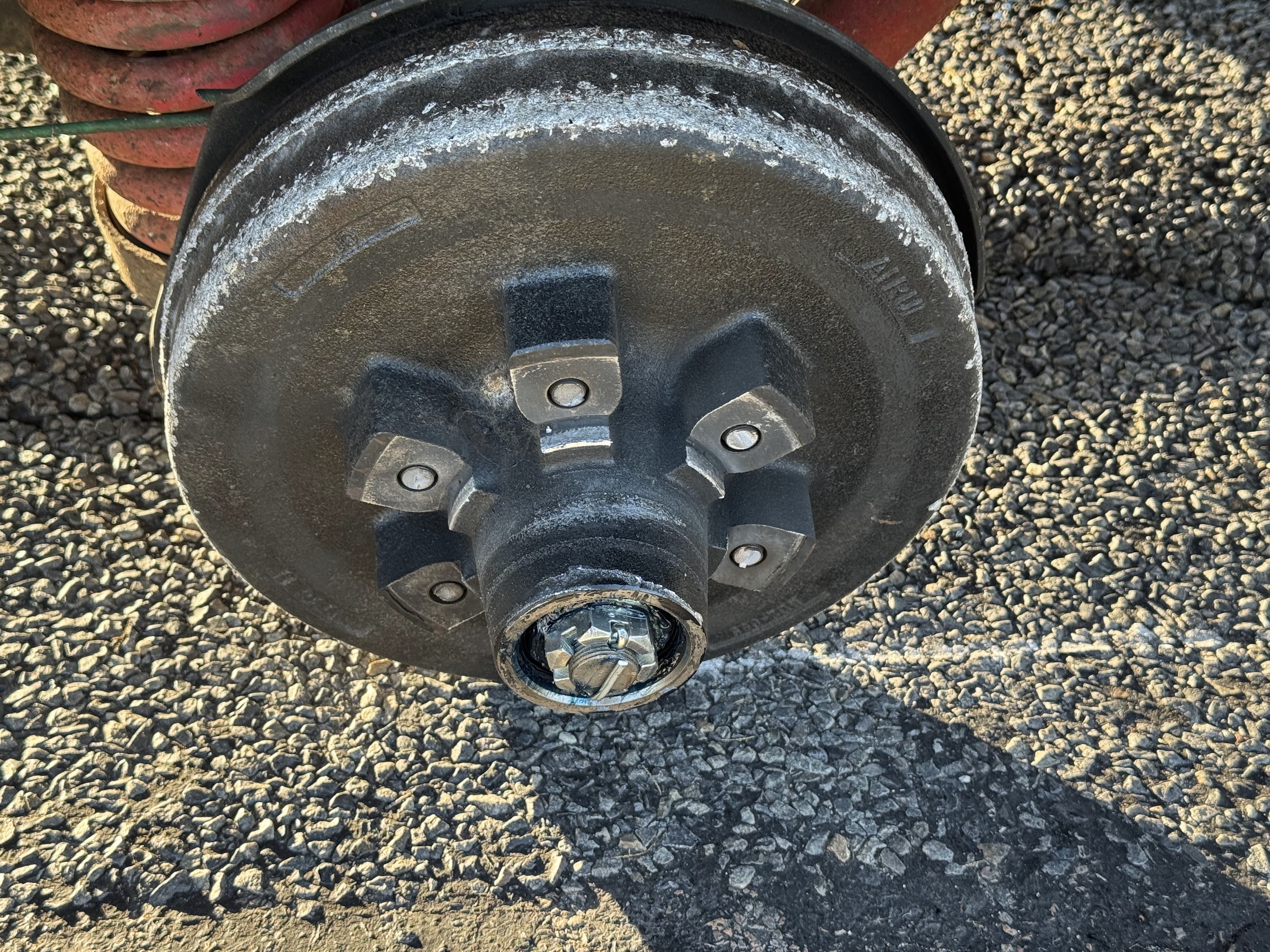 Close up of a caravan brake drum and hub with a fresh bearing and cap fitted
